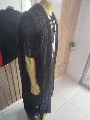 exquisite Agbada ensemble adorned with ancient African image embroidery, paired with sleek trousers and a distinguished Senator style, all crafted from luxurious Turkish lace fabric.