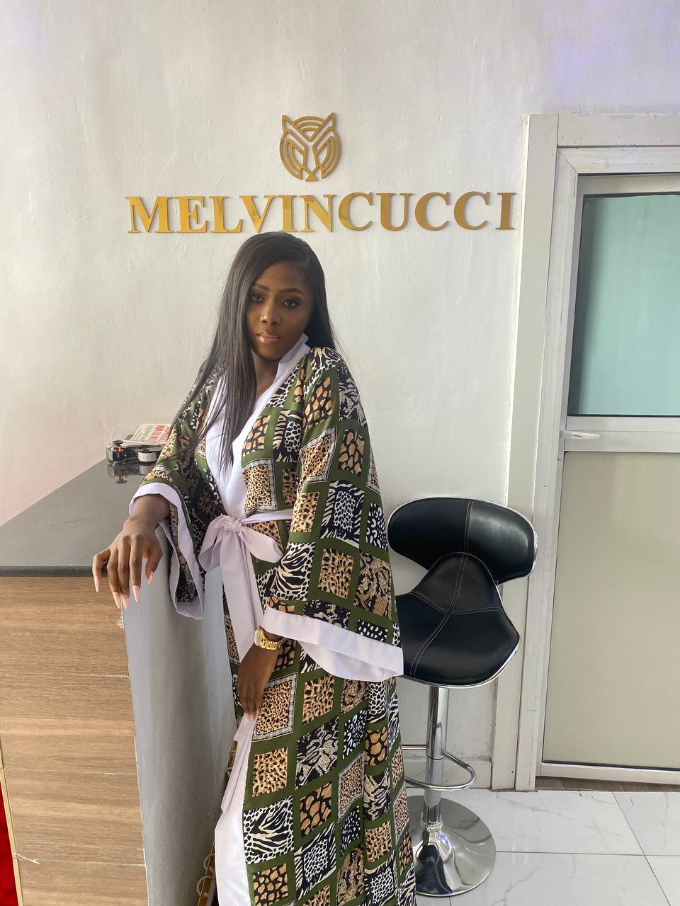 stunning  kimono dress, adorned with luxurious finishings