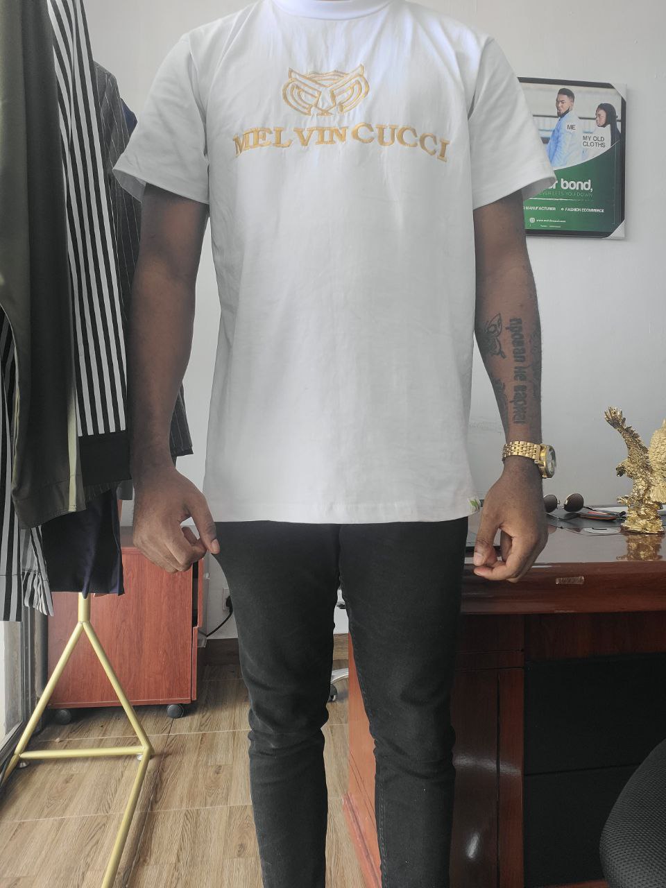 A white, “classic” men solid round neck Tee shirt with melvincucci logo embroidery
