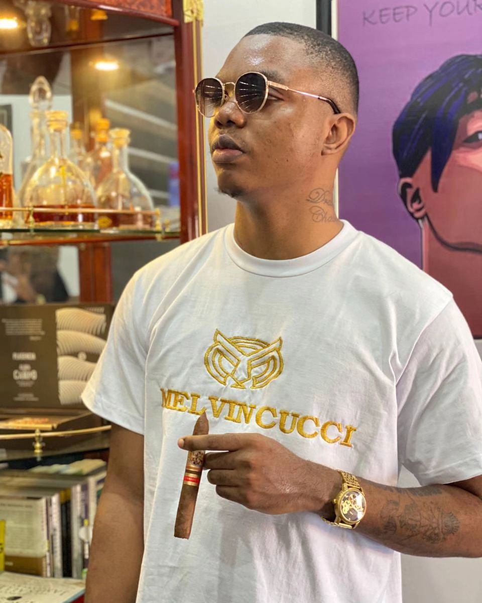 A white, “classic” men solid round neck Tee shirt with melvincucci logo embroidery