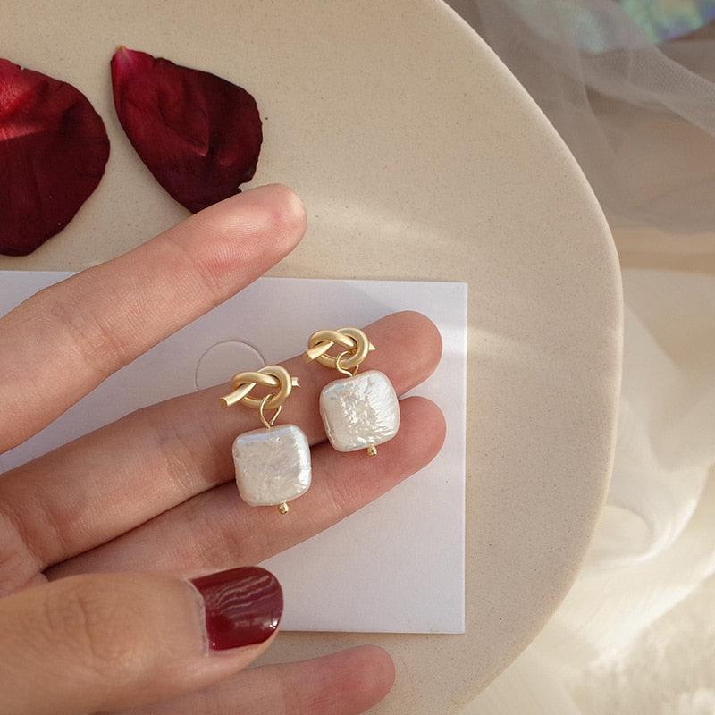 Natural pearl earrings - melvincucci