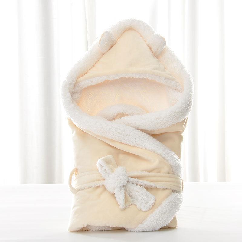 Newborn baby being hugged and swaddled by baby - melvincucci