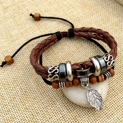 Cross stud braided leather bracelet - melvincucci
