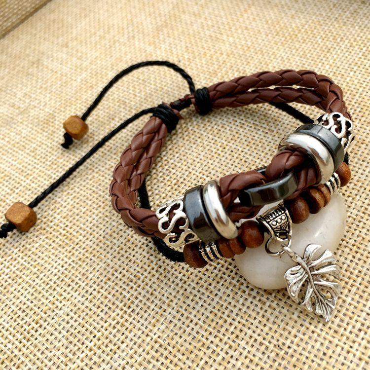 Cross stud braided leather bracelet - melvincucci