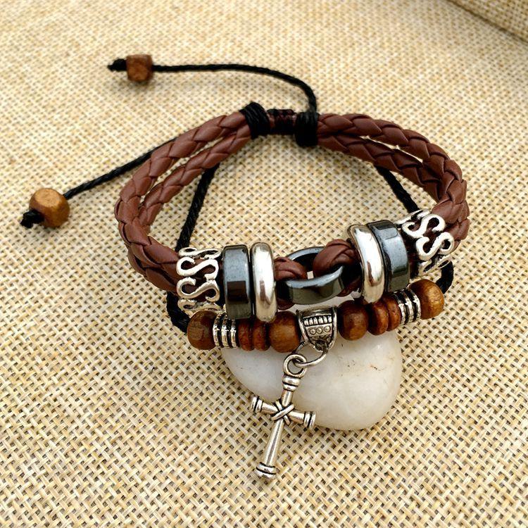 Cross stud braided leather bracelet - melvincucci