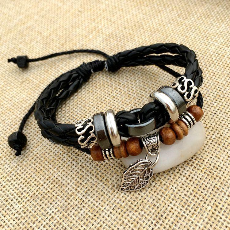 Cross stud braided leather bracelet - melvincucci