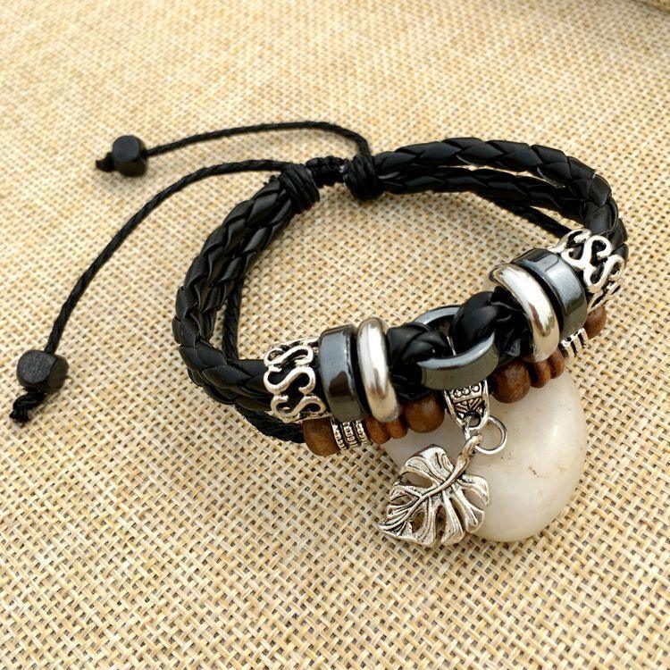 Cross stud braided leather bracelet - melvincucci