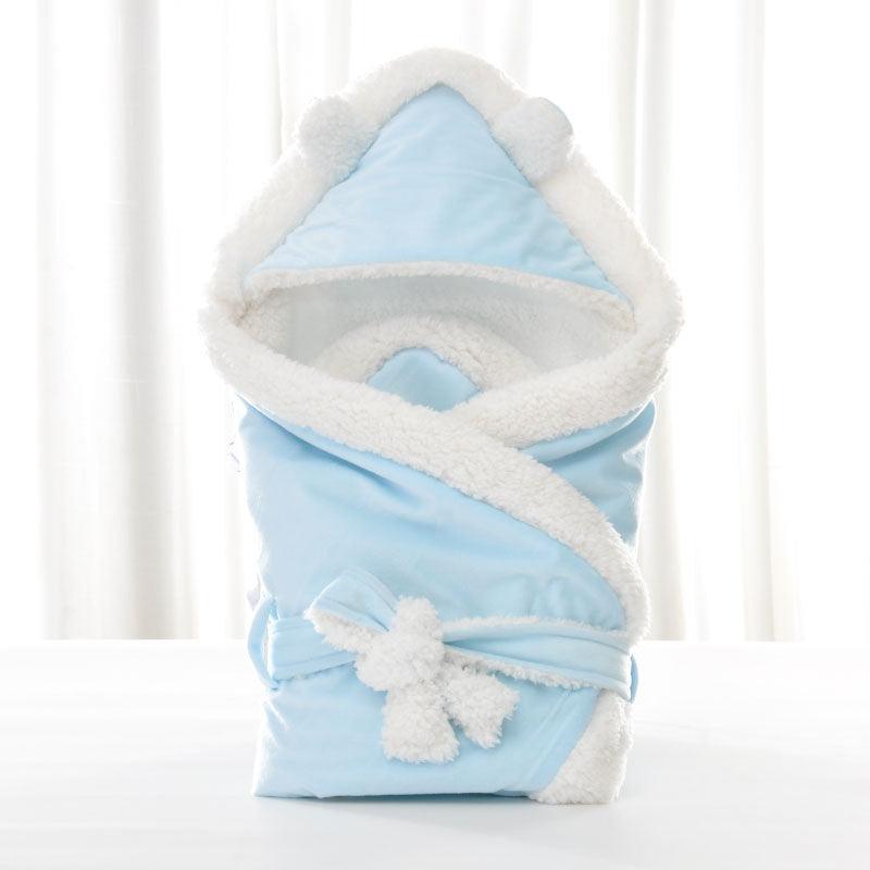 Newborn baby being hugged and swaddled by baby - melvincucci