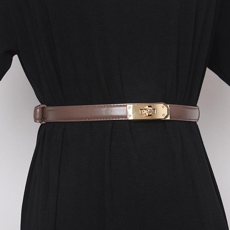 Belted Women Accessorize With Skirt And Sweater - melvincucci